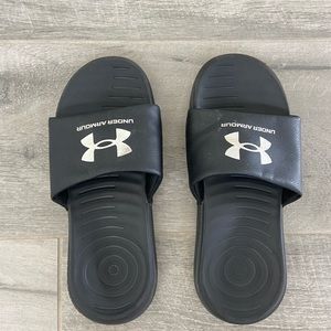 Under Armour black slides, size 6Y.